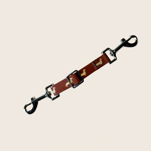 DoxieFlex Biothane dachshund dog safety clip connecting a collar and harness for extra security on walks.