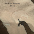 Load image into Gallery viewer, Water beading on the soft water-resistant fleece fabric used in the DoxieDri dachshund harness fleece
