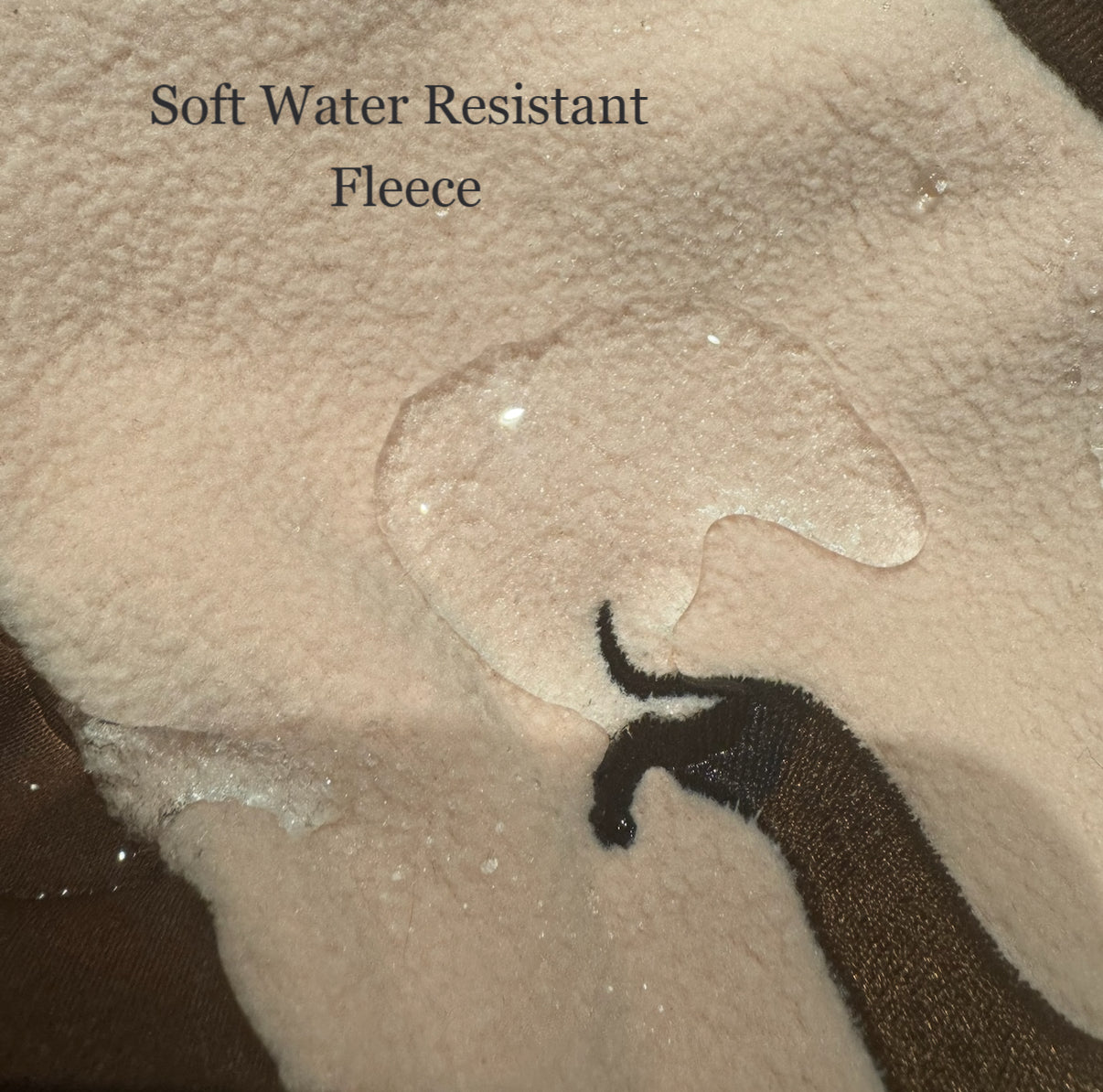 Water beading on the soft water-resistant fleece fabric used in the DoxieDri dachshund harness fleece